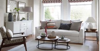 neutral living room with soft patterned cushions and blinds to show how to avoid living room design mistakes