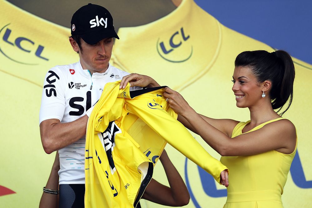 Geraint Thomas puts on the yellow jersey after stage 3 at the Tour de France
