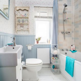 bathroom with white flooring and white bathtub white wash basin