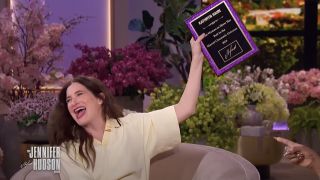 Kathryn Hahn holding up Agatha All Along plaque for showing her butt in the MCU on The Jennifer Hudson Show