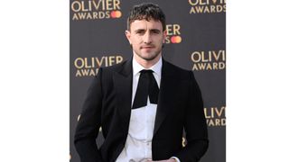 Paul Mescal with a mullet, wearing a black suit and bow tie as he attends The Olivier Awards 2023 at the Royal Albert Hall on April 02, 2023 in London, England.