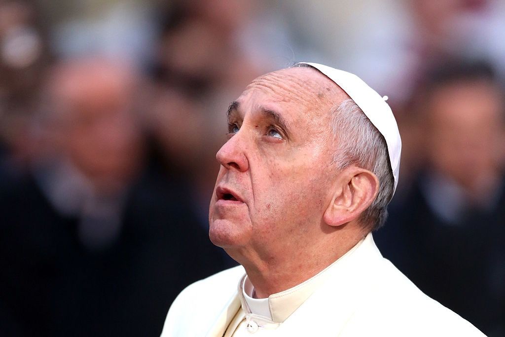 Pope Francis prays in front of the statue of the Immaculate Conceptionon at Spanish Steps on Dec. 8, 2013, in Rome, Italy.