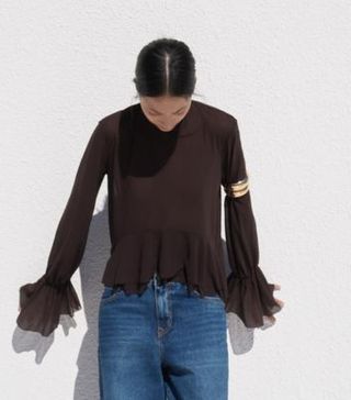 image of woman wearing ruffled blouse