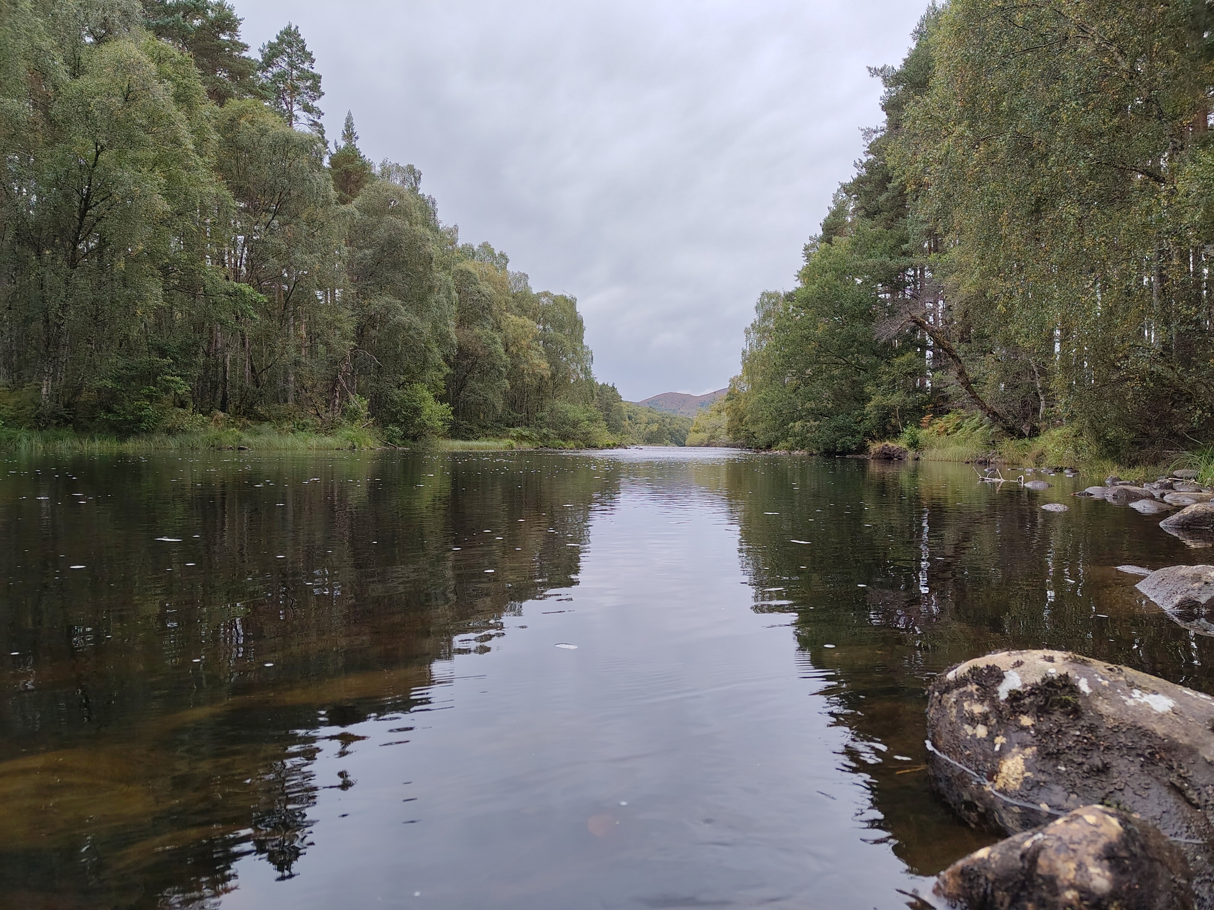 A camera sample taken on the Fairphone 6 showing a river with a mountain in the background.