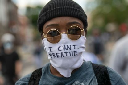 Protester wearing a mask.