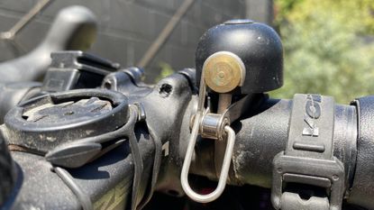 Slightly tarnished and very used RockBros Vintage style bike bell mounted to a gravel bike handlebar