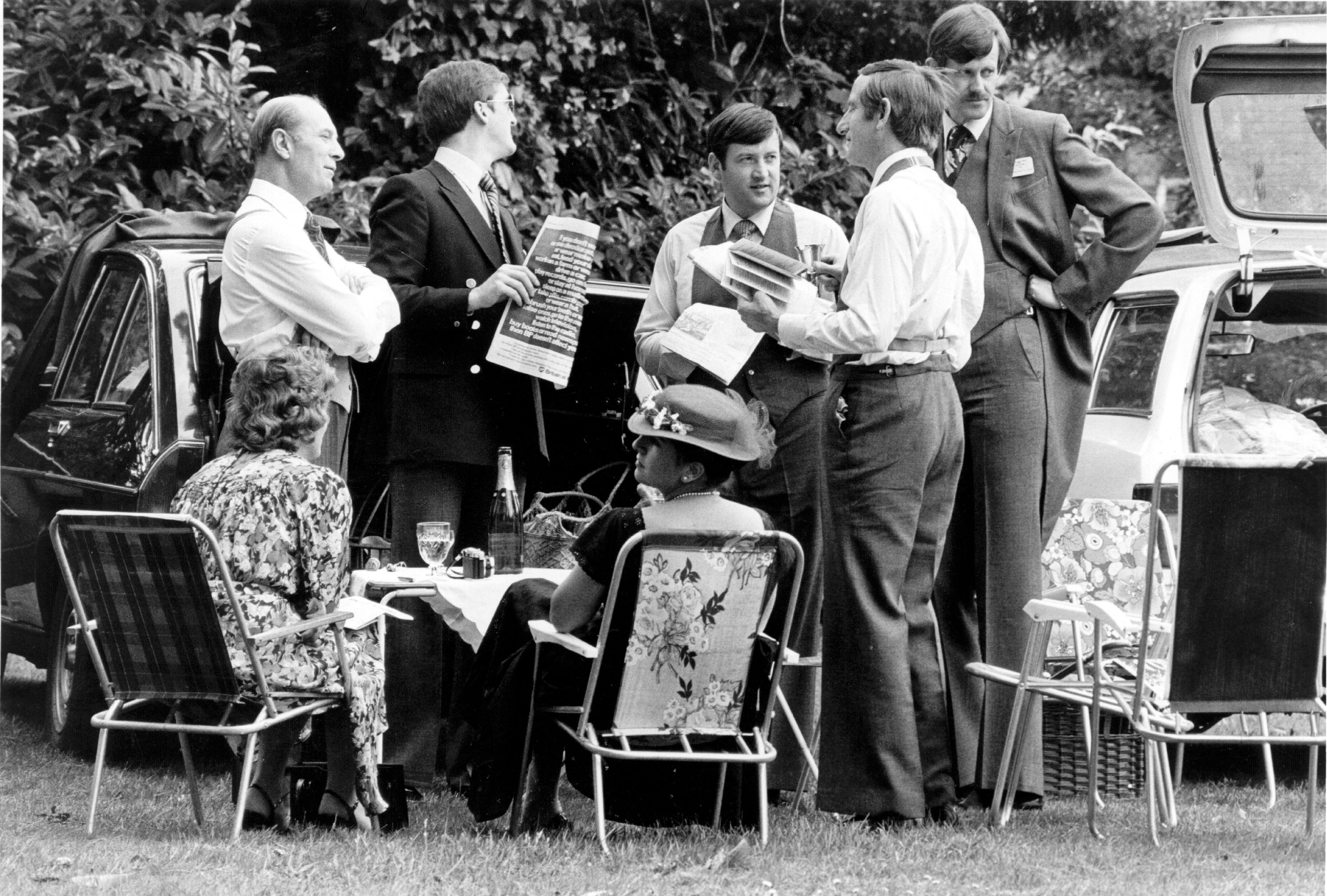 Black and white photograph of a group of people having a picnic at Royal Ascot 