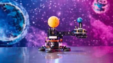 Lego Technic Earth and Moon in Orbit set on a colorful space background