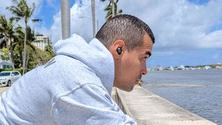 Best workout headphones: Our reviewer wearing the JLab JBuds Air Pro on an outdoor run