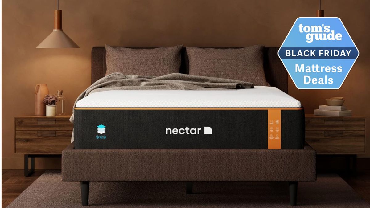 Nectar Premier Copper mattress in brown bedroom with two bedside tables and two wall lamps either side of brown bed base with Tom&#039;s Guide Black Friday mattress sales logo