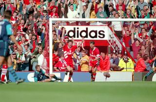 Robbie Fowler is congratulated by Ian Rush after scoring a hat-trick for Liverpool against Arsenal in August 1994.