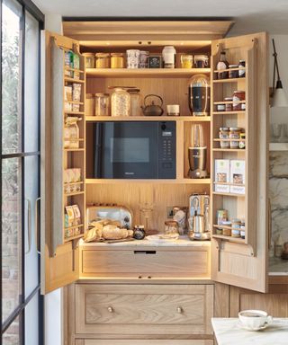 wood pantry cupboard with appliance garage built-in microwave