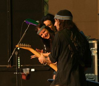 Juliette Lewis checks out Campbell's moves side stage at Hyde Park as Motorhead support the Foo Fighters in 2006