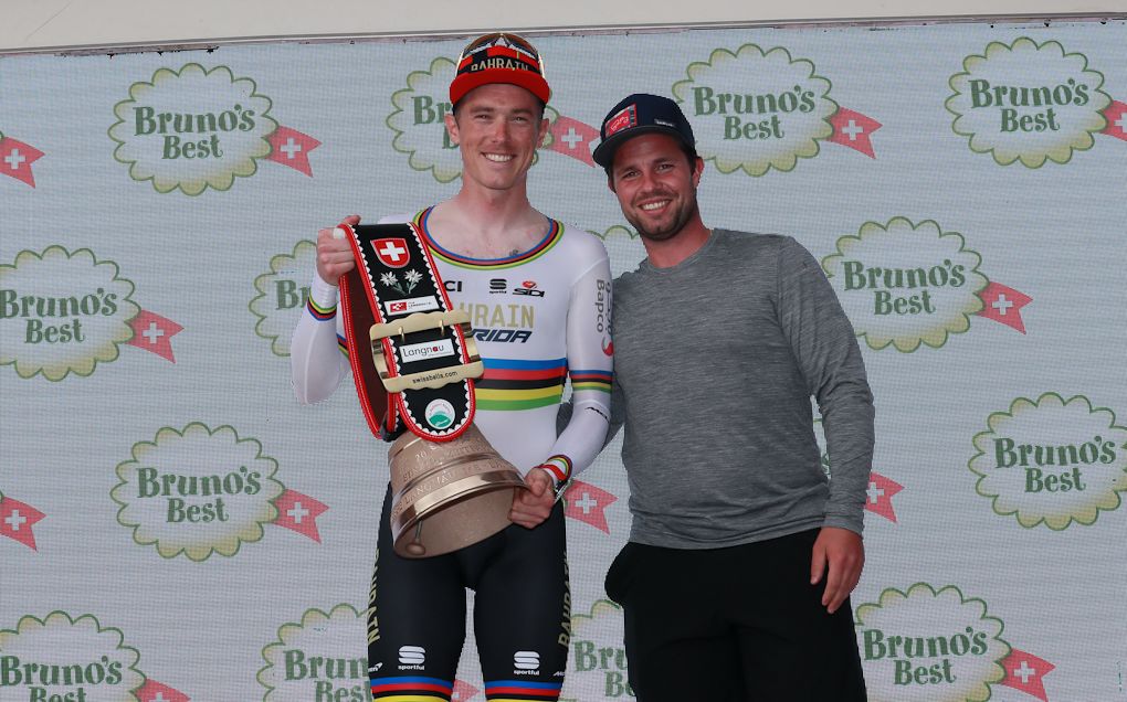 Rohan Dennis on the stage 1 podium at Tour de Suisse after winning the opening time trial