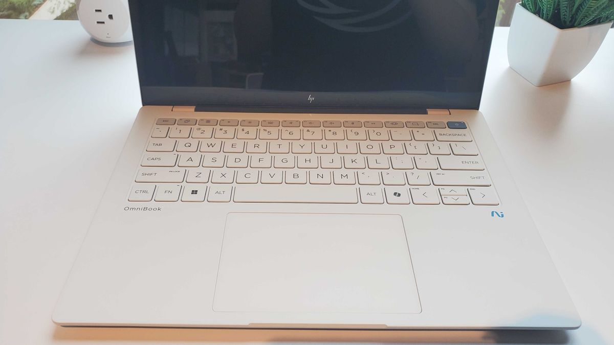 white laptop on table
