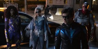 starfire, nightwing, hawk and dove on the streets of gotham city on titans season 3