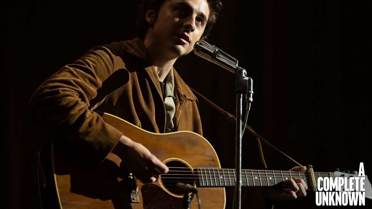 Timothée Chalamet as Bob Dylan with Gibson acoustics in a still from A Complete Unknown, the James Mangold biopic about the iconic singer-songwriter