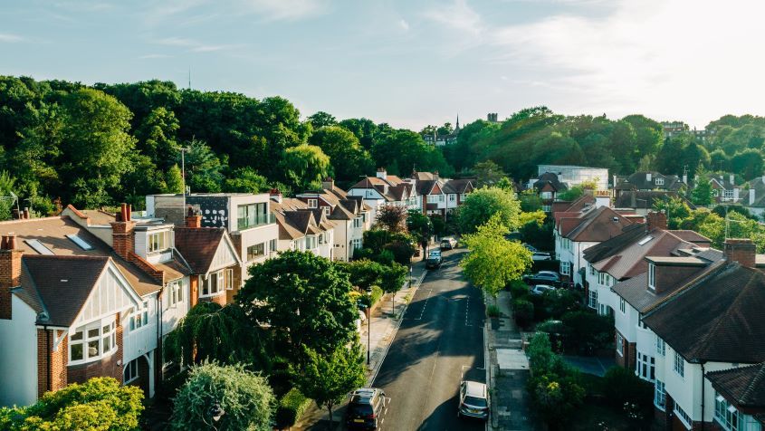 An elevated view of London houses at sunset