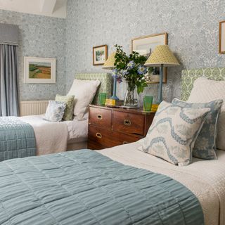 Twin bedroom in a period home with a mix of pattern and colour