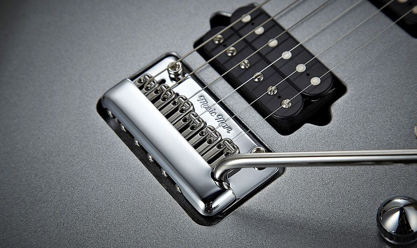 The saddles on the JP13 bridge each have a piezo element