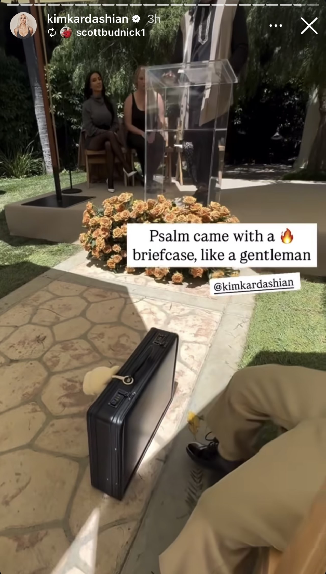 Psalm West is shown in a suit with a briefcase in photos from Kim Kardashian's Instagram Stories celebrating her graduation from lawschool.
