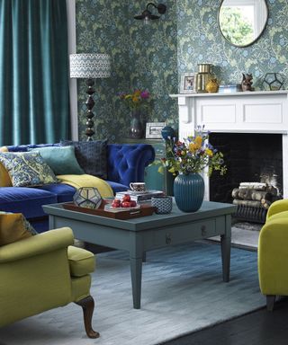 living room with printed walls and sofaset with cushions