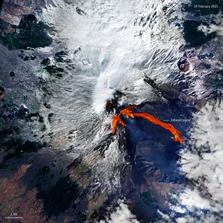 In this image taken from space, you can see Mount Etna in Italy, one of the most active volcanoes in the entire world, erupting. The image was captured Feb. 18 by the European Space Agency's Copernicus Sentinel-2 mission, which is made up of two different orbiting, Earth-observing satellites. The volcano erupted twice within less than 48 hours, spewing ash and spouting a fountain of lava, erupting Feb. 16 and then again Feb. 18.