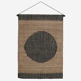a wall hanging with a circle on