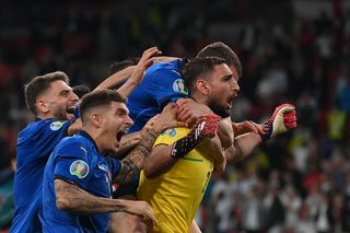 Gianluigi Donnarumma celebrates with his team-mates after Italy's win over England in the final of Euro 2020.