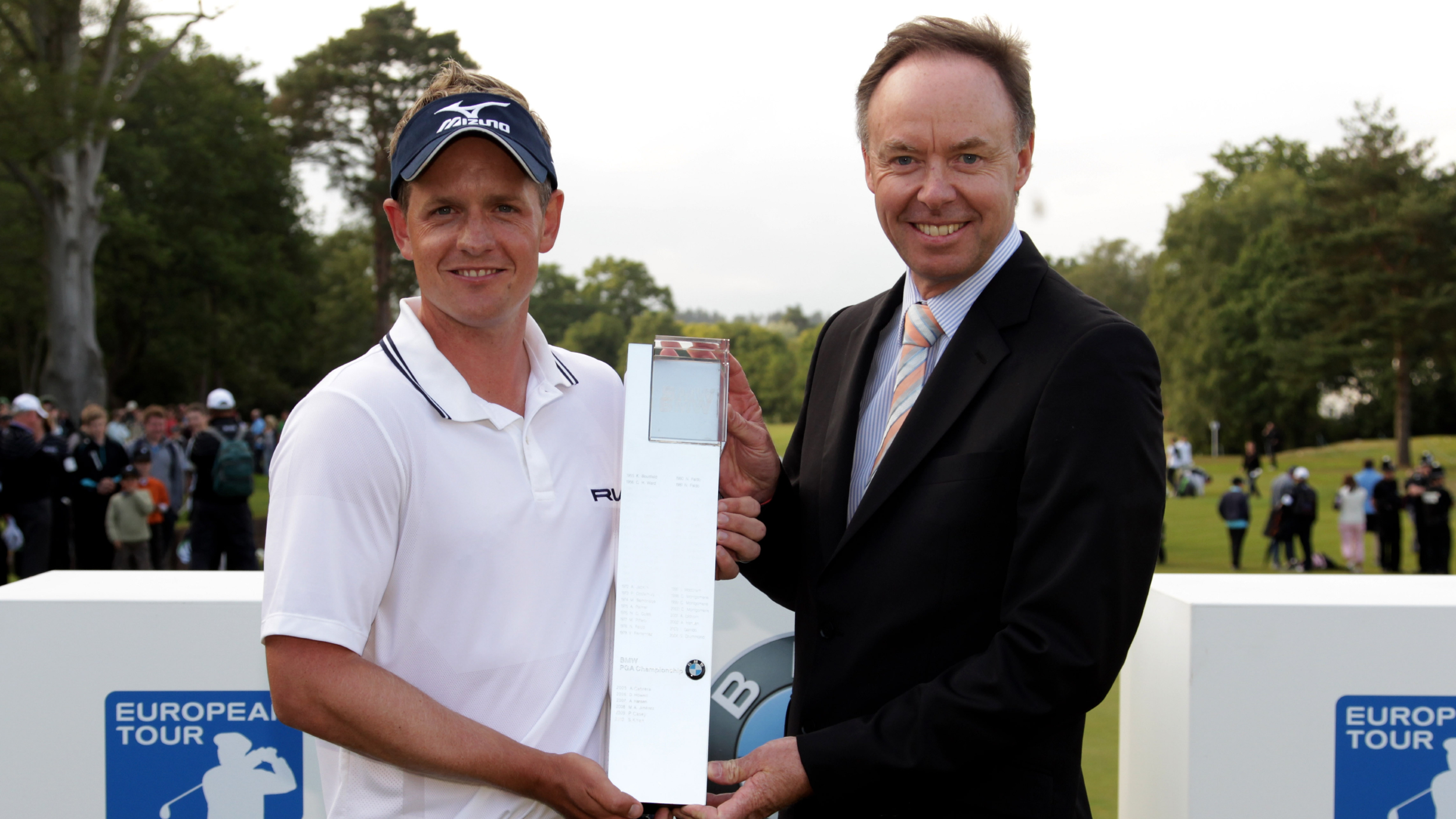Luke Donald is presented with the BMW PGA Championship trophy