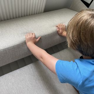 Child assembling Swyft Model sofa