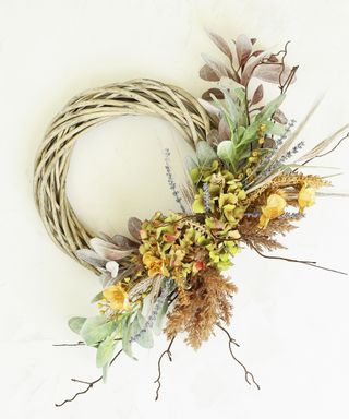 Half wreath made from twigs and dried flowers