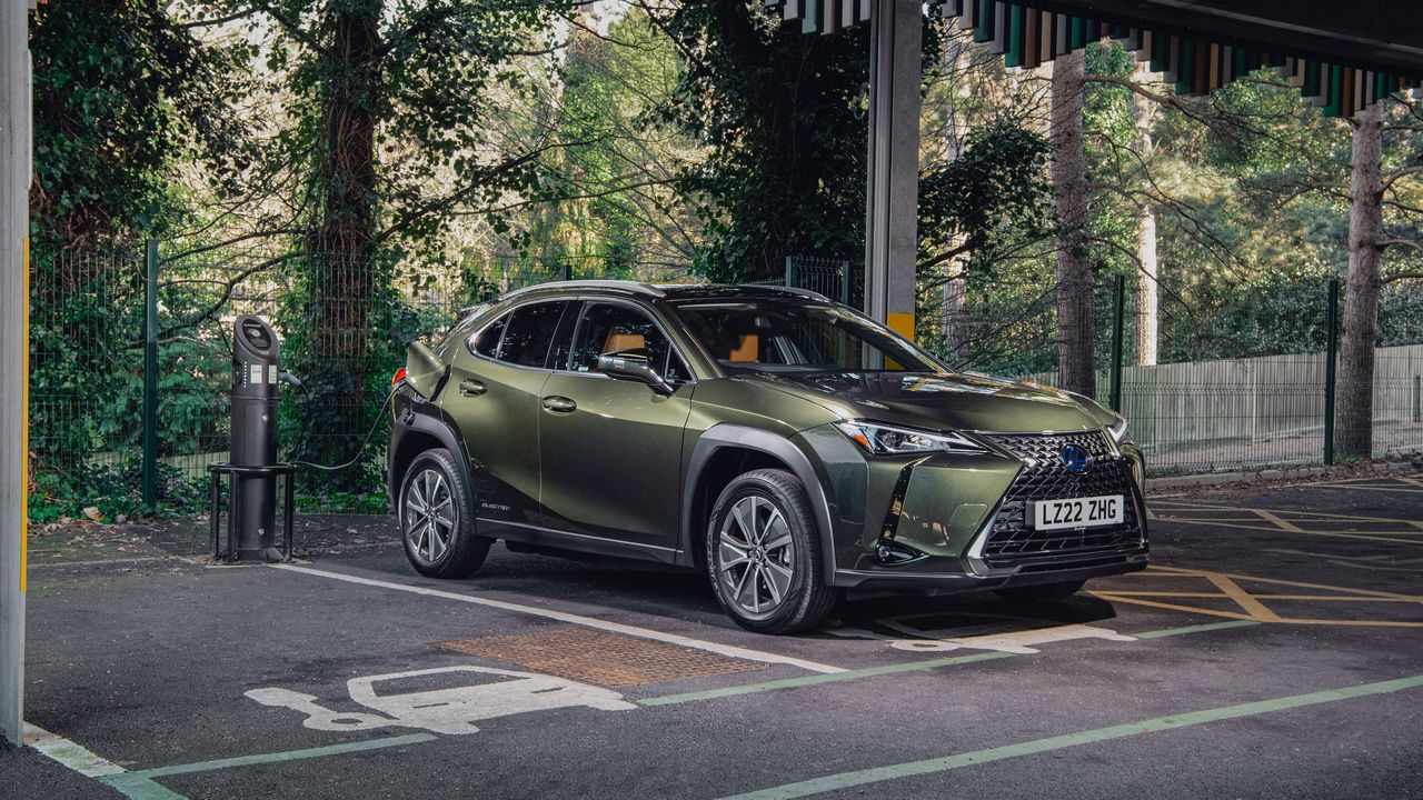 Green Lexus UX 300e in a car park