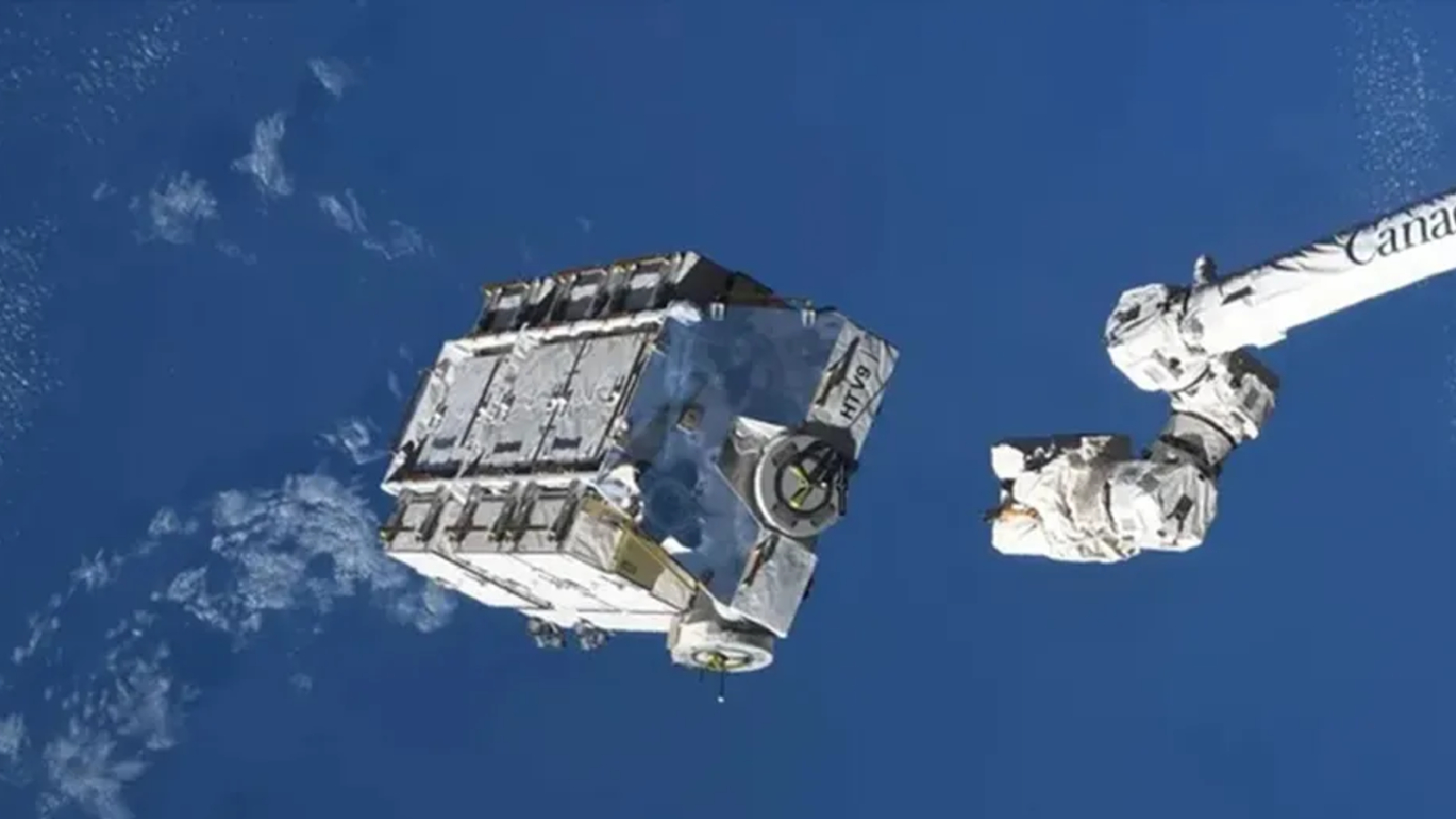 A photo of a large battery pack dethatching from the ISS in space