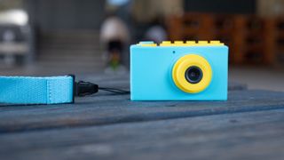 the myFirst Camera 2 from the front showing a very vibrant blue and yellow color combination