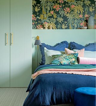 Green bedroom with botanical feature wall panel