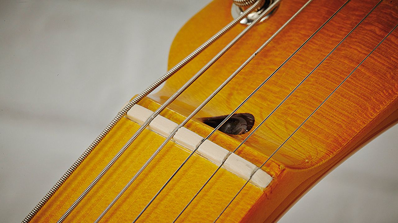 The truss rod adjustment takes place at the headstock end