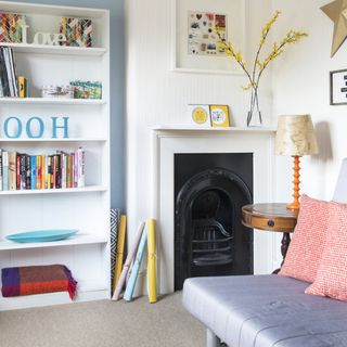 bedroom with fireplace and white shelves