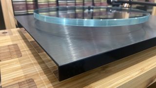 Rega Planar 3 RS Edition turntable side angle showing plinth and platter detail