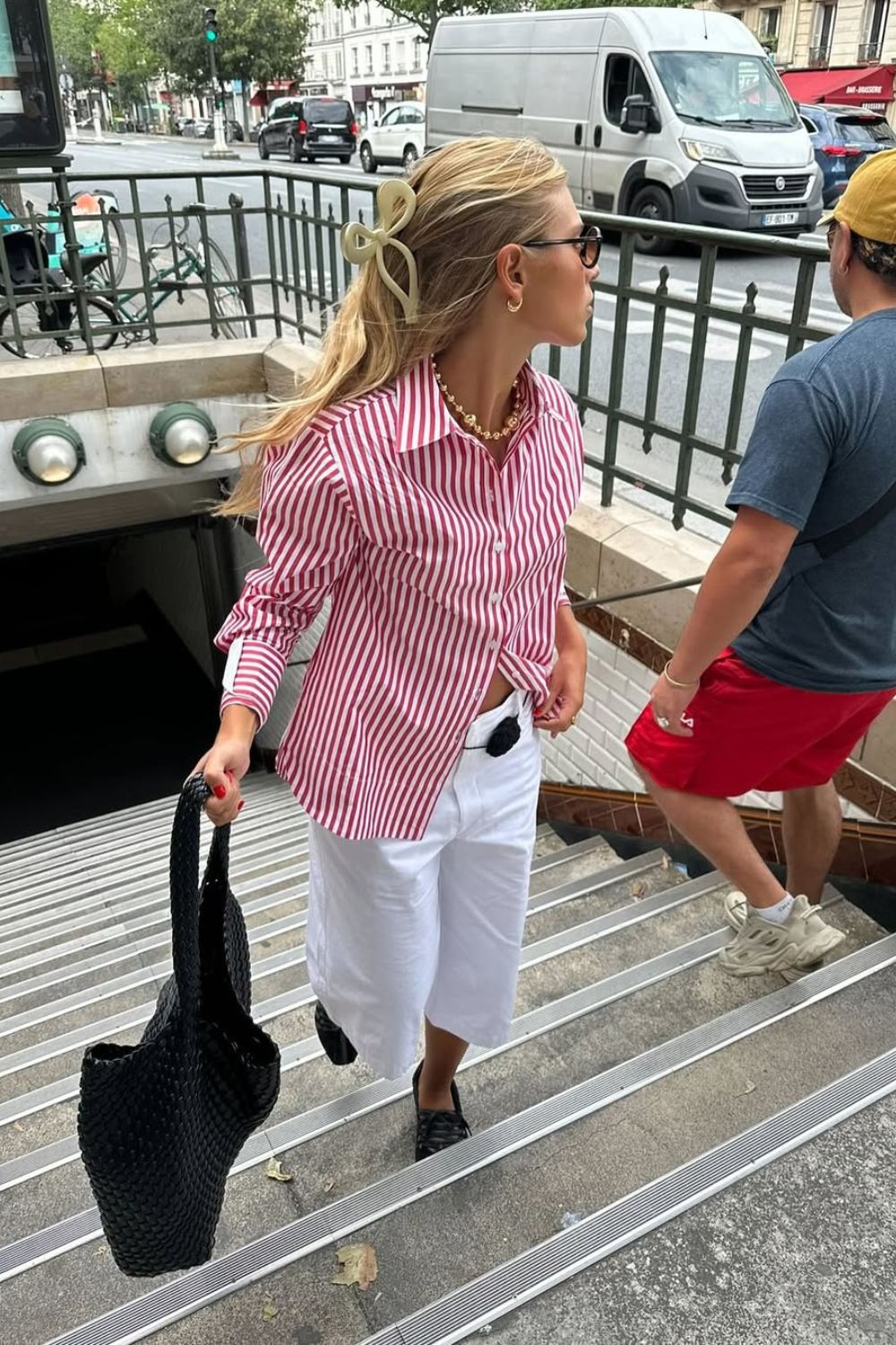 a girl wearing white jeans and a striped shirt