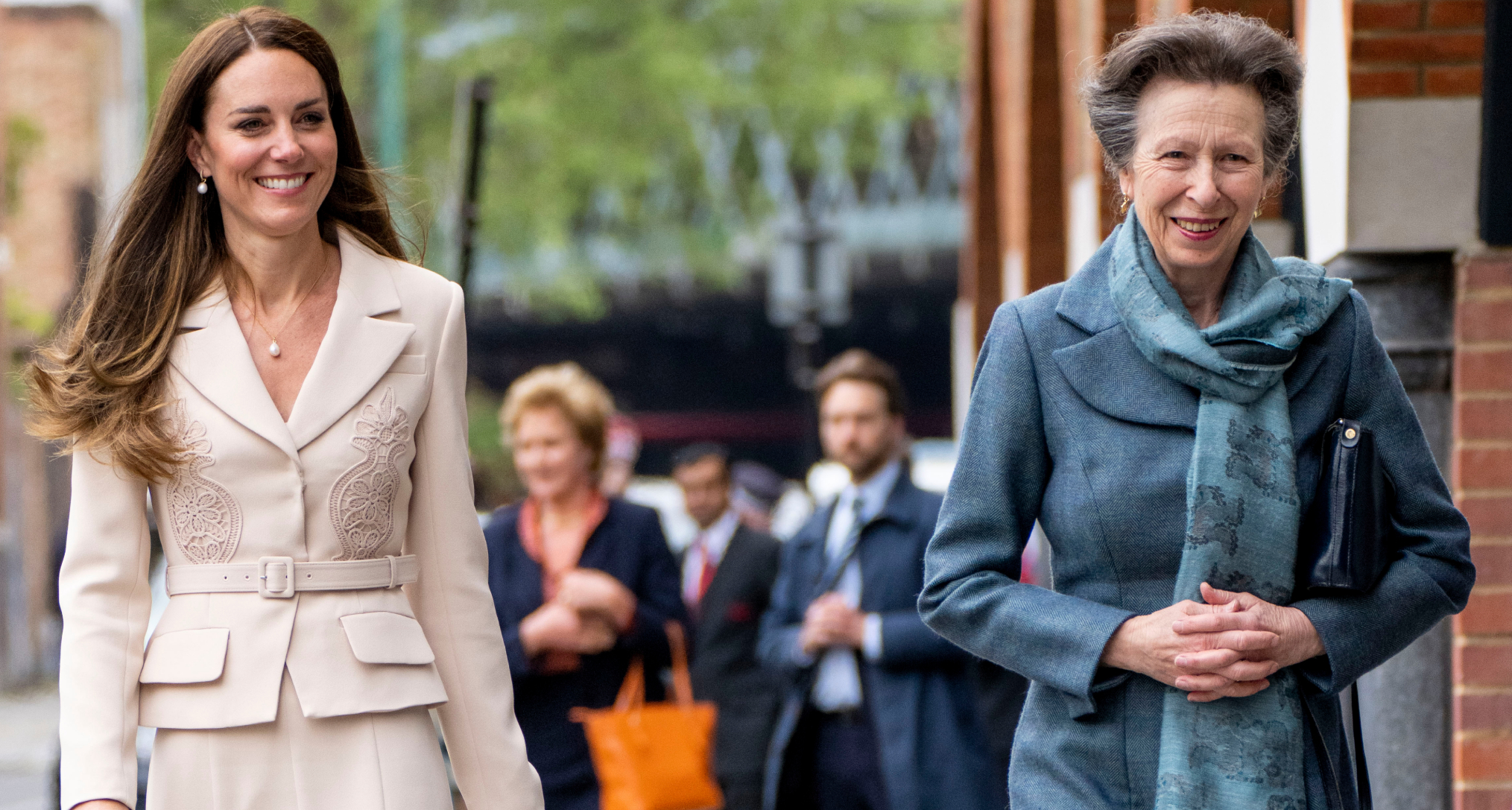 Princess Anne and Princess Kate walking down a street and smiling