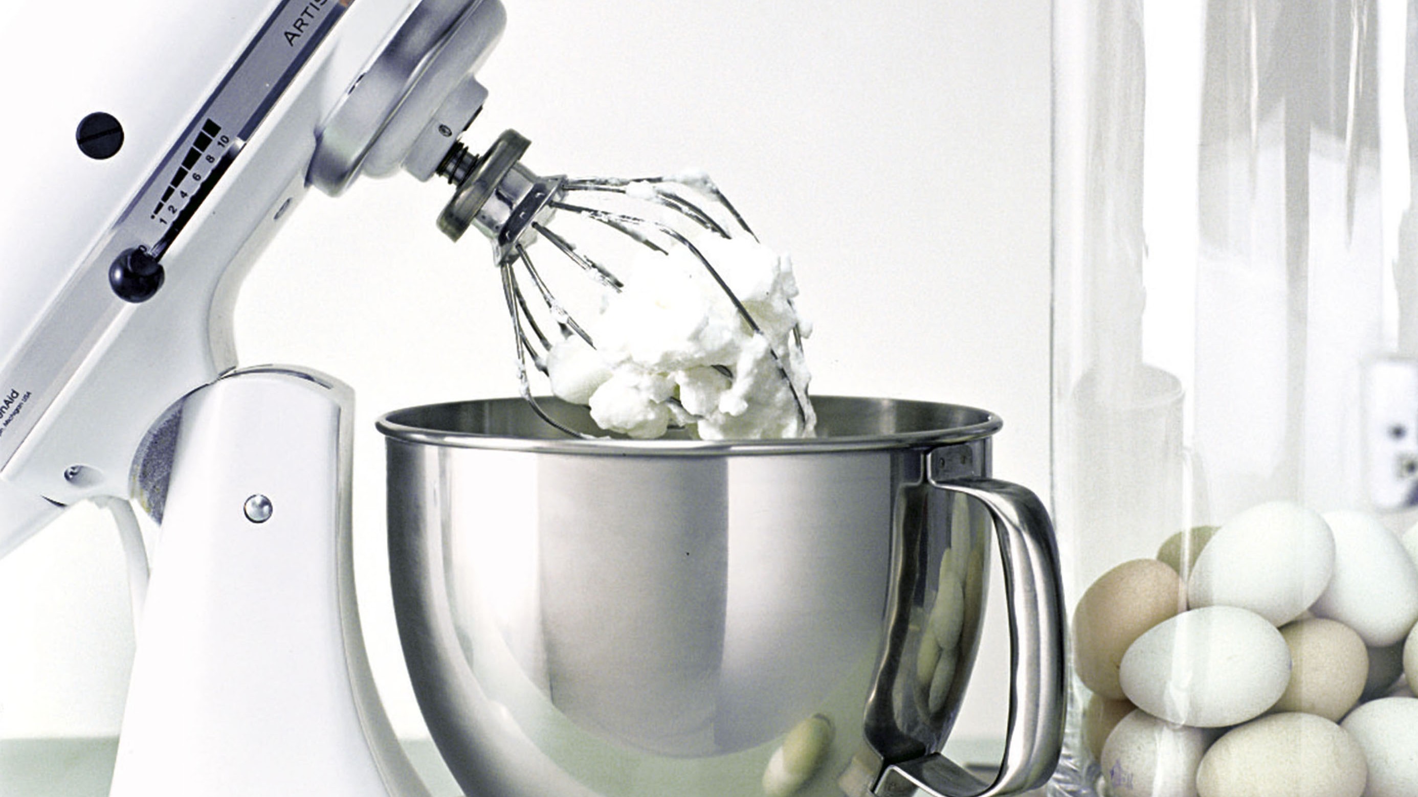 KitchenAid stand mixer being used to beat eggs