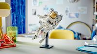 Lifestyle shot of the Lego Space Astronaut perched on a desk