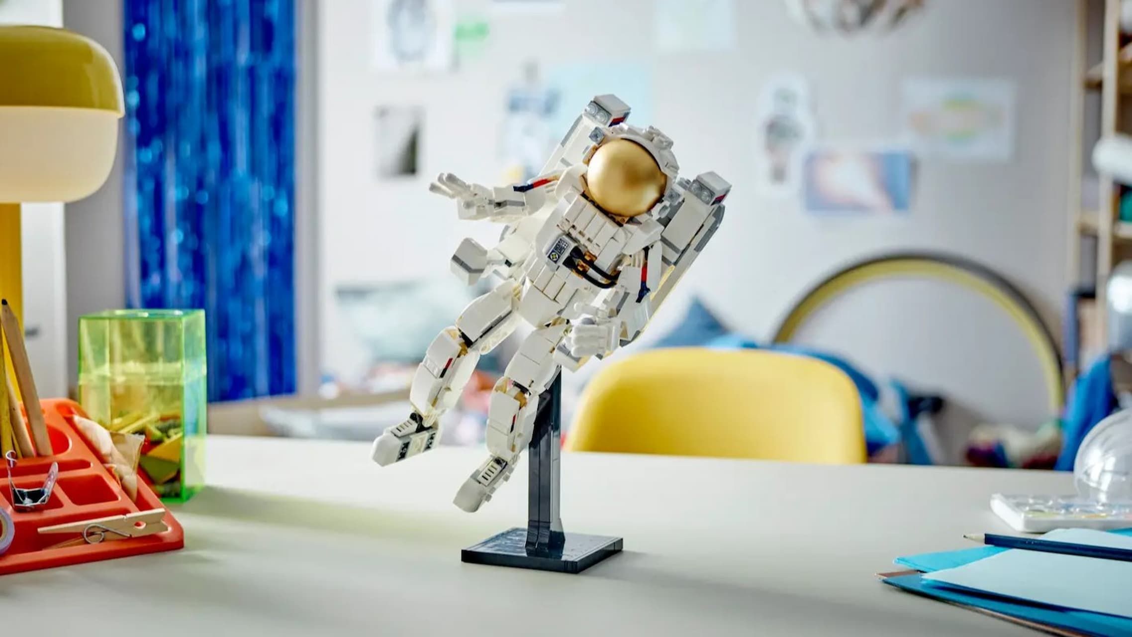 Photo: space.com Lifestyle shot of the Lego Space Astronaut perched on a desk