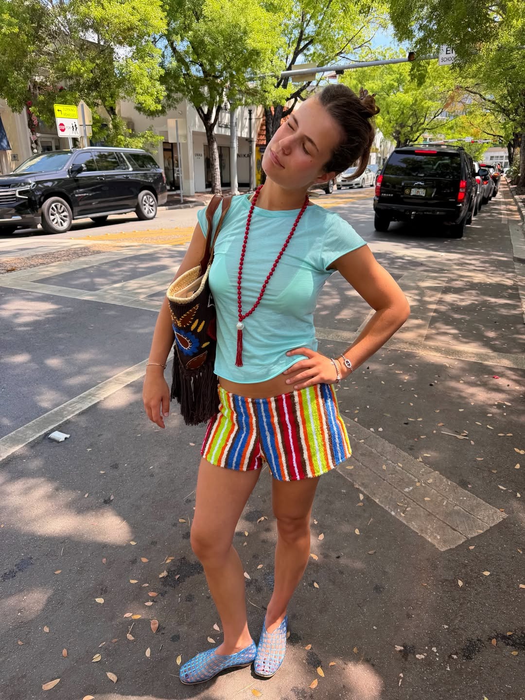 Woman in a t-shirt and stripe shorts