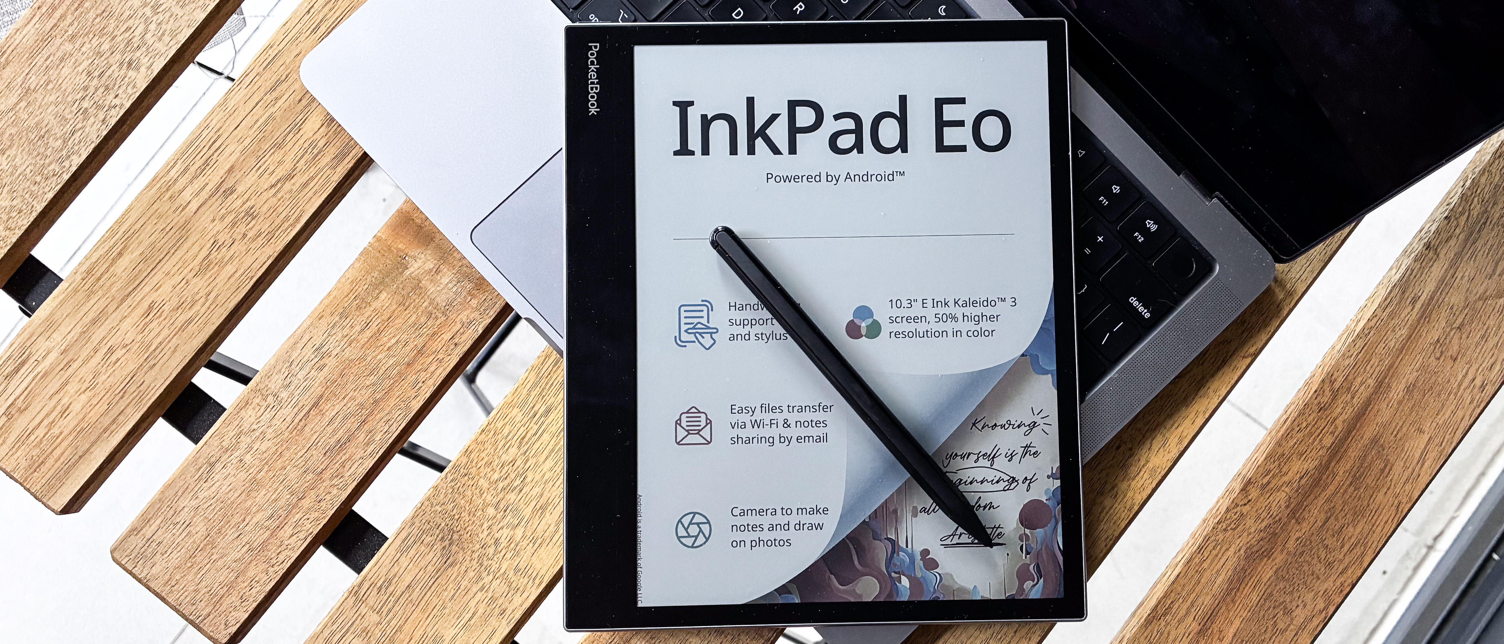PocketBook InkPad Eo with its stylus on a laptop