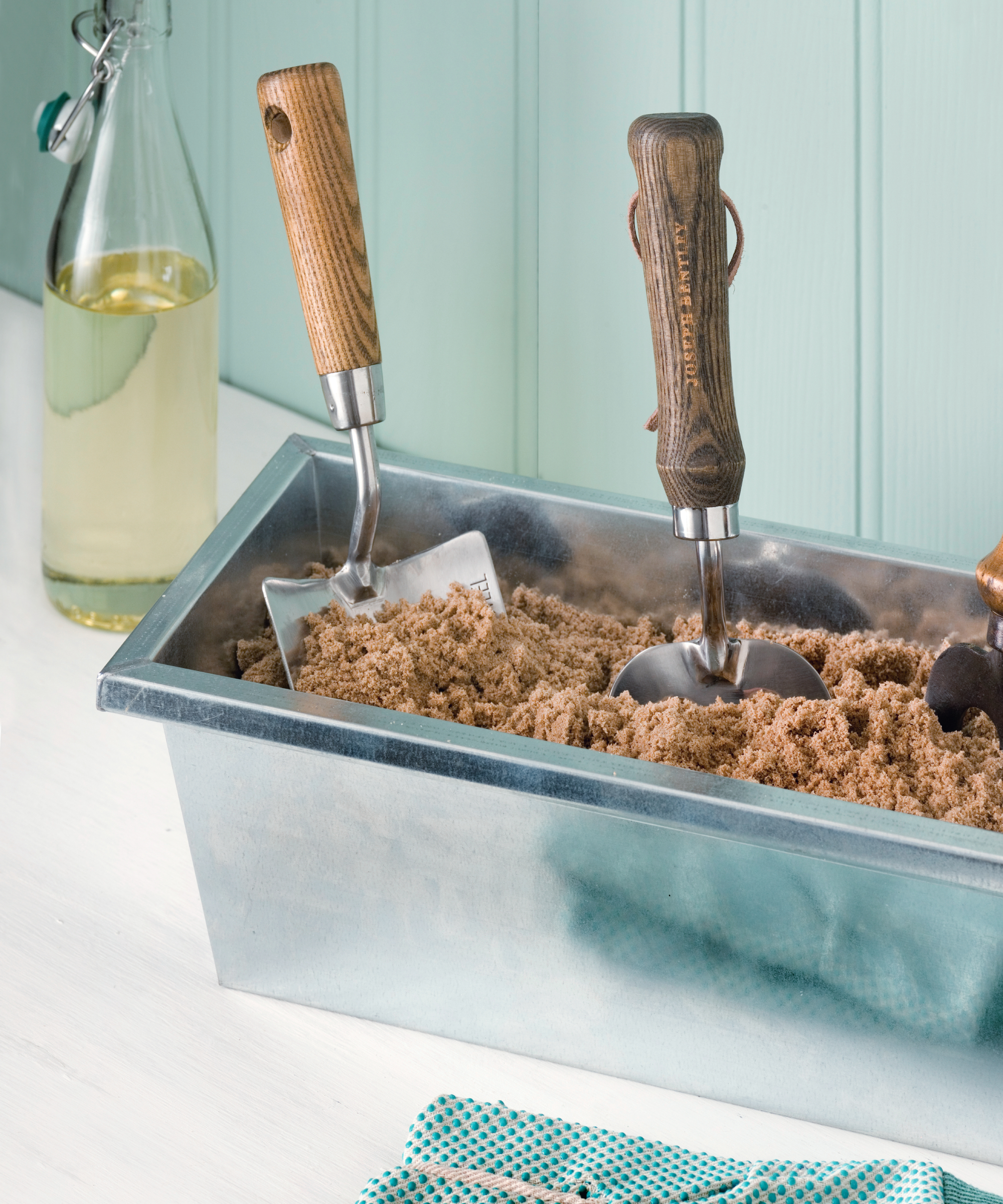 Garden tools. Idea for keeping garden tools rust free. zinc trough planter filled with sand, handheld tools