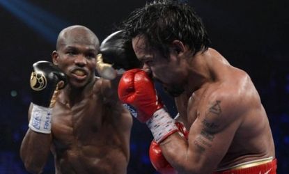 Timothy Bradley lands a left to the head of Manny Pacquiao during their WBO welterweight title fight at on June 9: Bradley went on to defeat the long-unbeaten Pacquiao in a split decision.