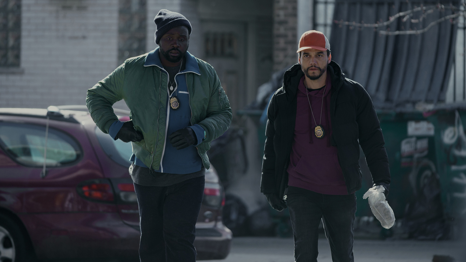 Two characters walking down a street in Apple's Dope Thief TV series