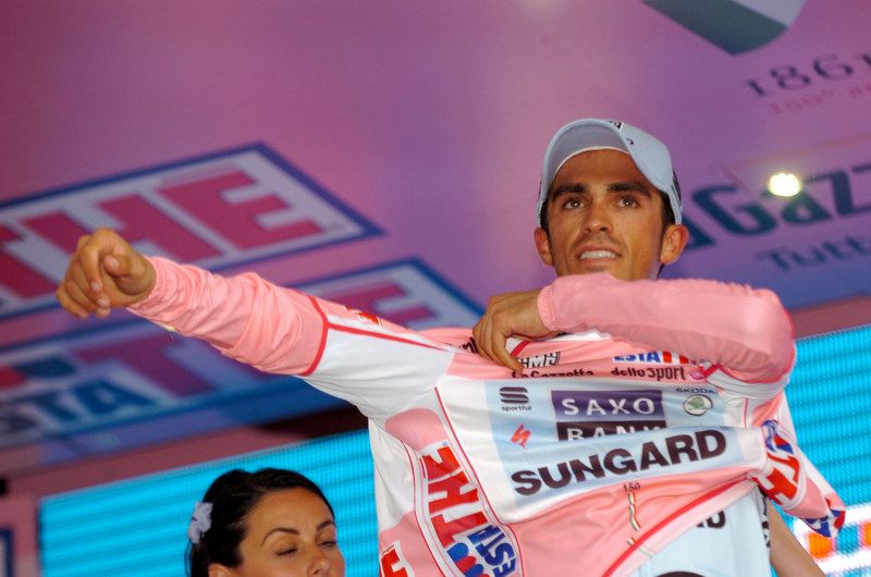 Alberto Contador pulls on another maglia rosa in 2011 after winning the time trial
